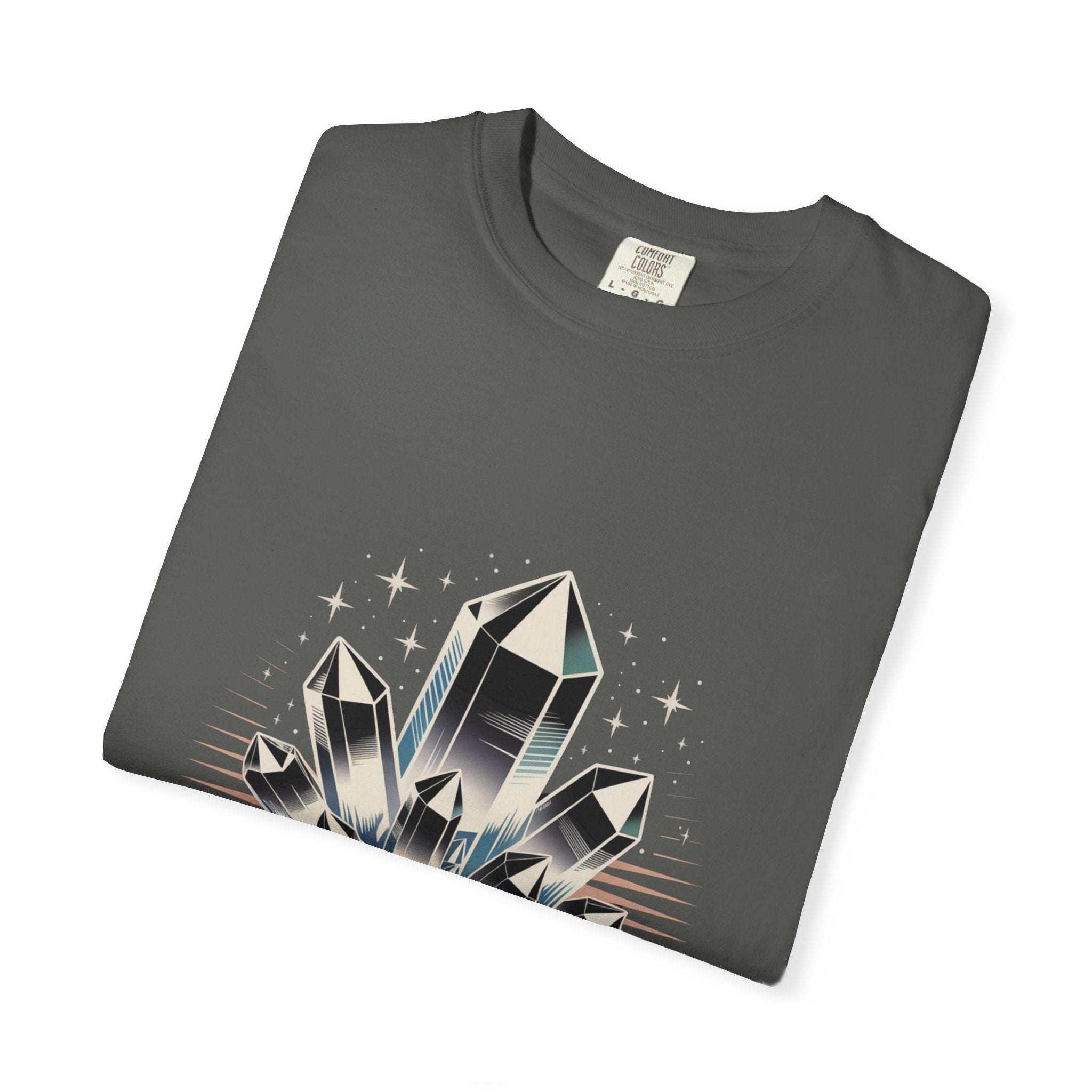 Folded dark gray t-shirt with crystal graphic design on a white background