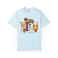 Chambray NICU nurse Halloween T-shirt with patchwork lettering, a sleeping baby in a pumpkin hat, ghosts, and jack-o’-lanterns.