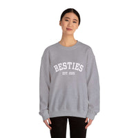 Person wearing a gray sweatshirt with 'BESTIES EST. 2025' text on a white background