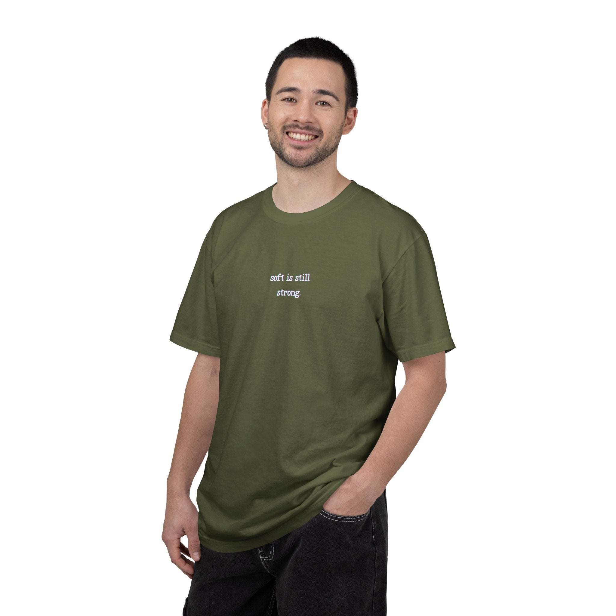 Man wearing a green t-shirt with text on a white background