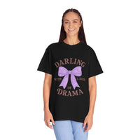Person wearing a black t-shirt with a purple bow graphic and text on a white background