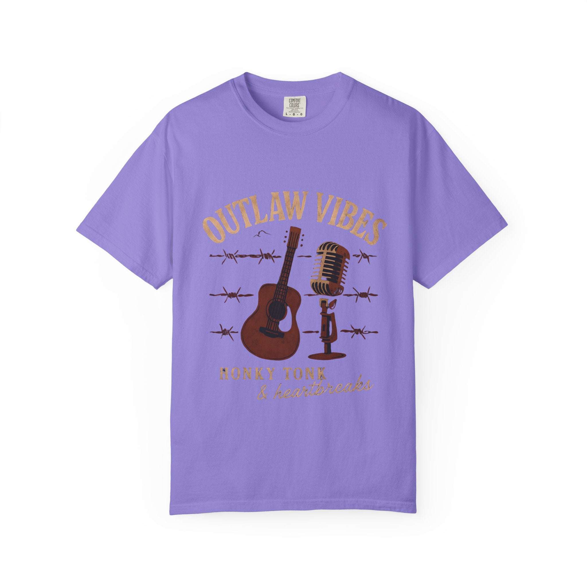 Purple t-shirt with 'Outlaw Vibes' graphic design featuring a guitar, microphone, and barbed wire on a white background.
