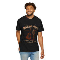 Man wearing a black t-shirt with 'Outlaw Vibes' graphic design on a white background