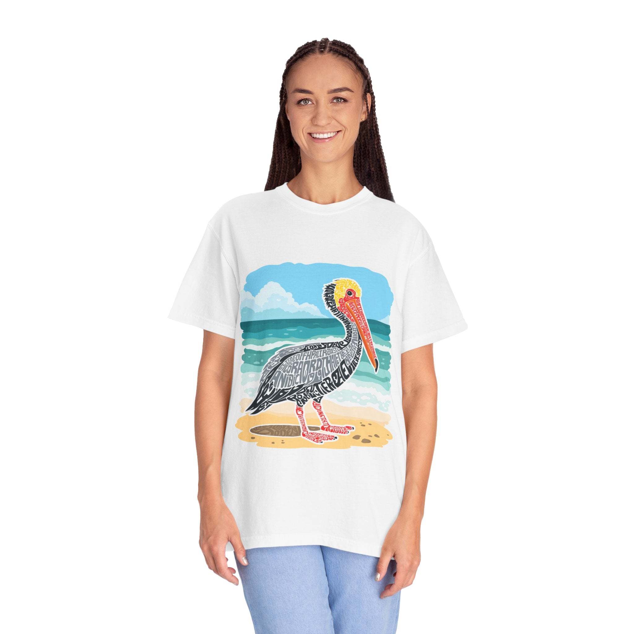 Woman wearing white vintage coastal graphic tee with pelican letter poster design on beach background
