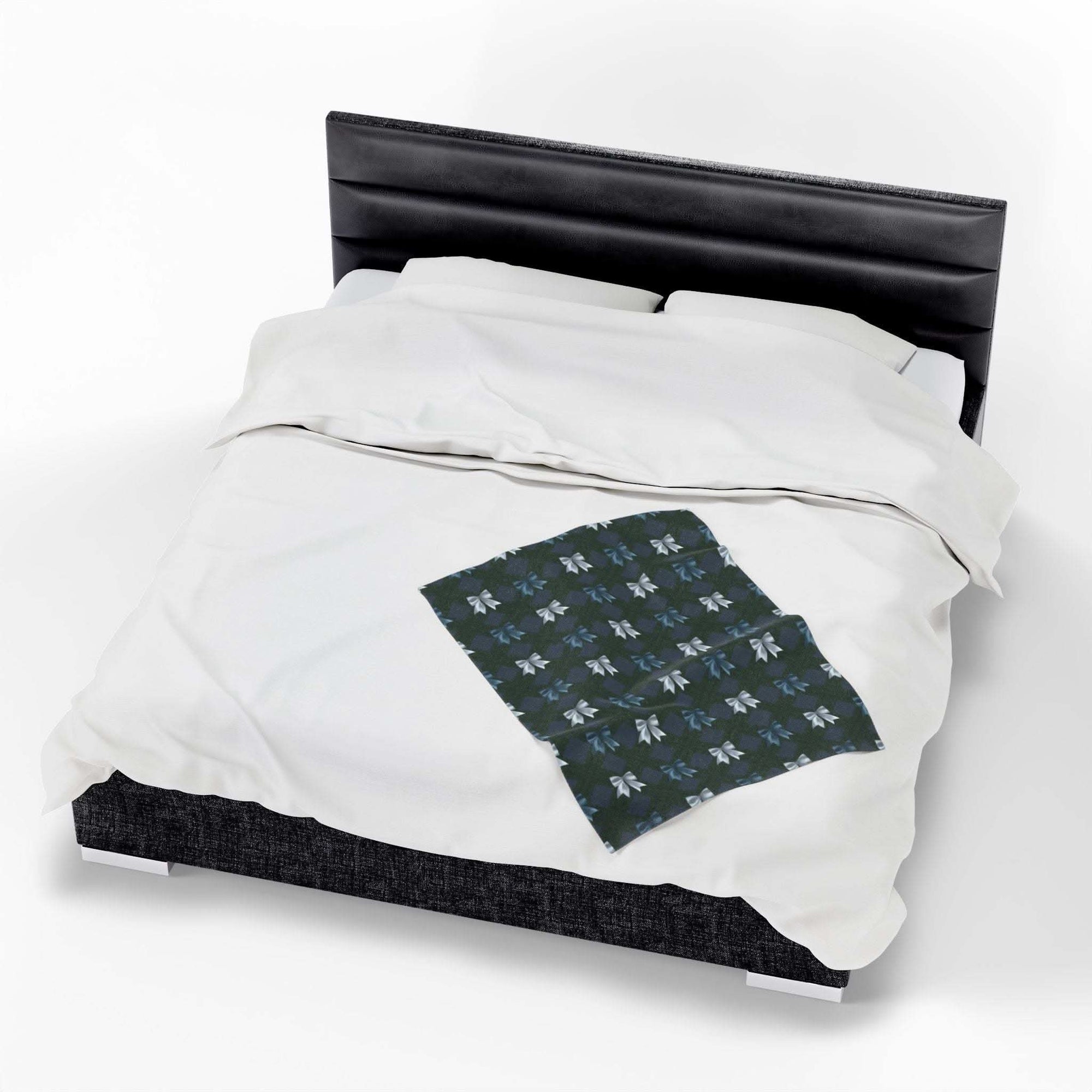 Velveteen plush blanket with winter coquette bows design on bed, cozy festive holiday decor, soft quick-drying polyester material