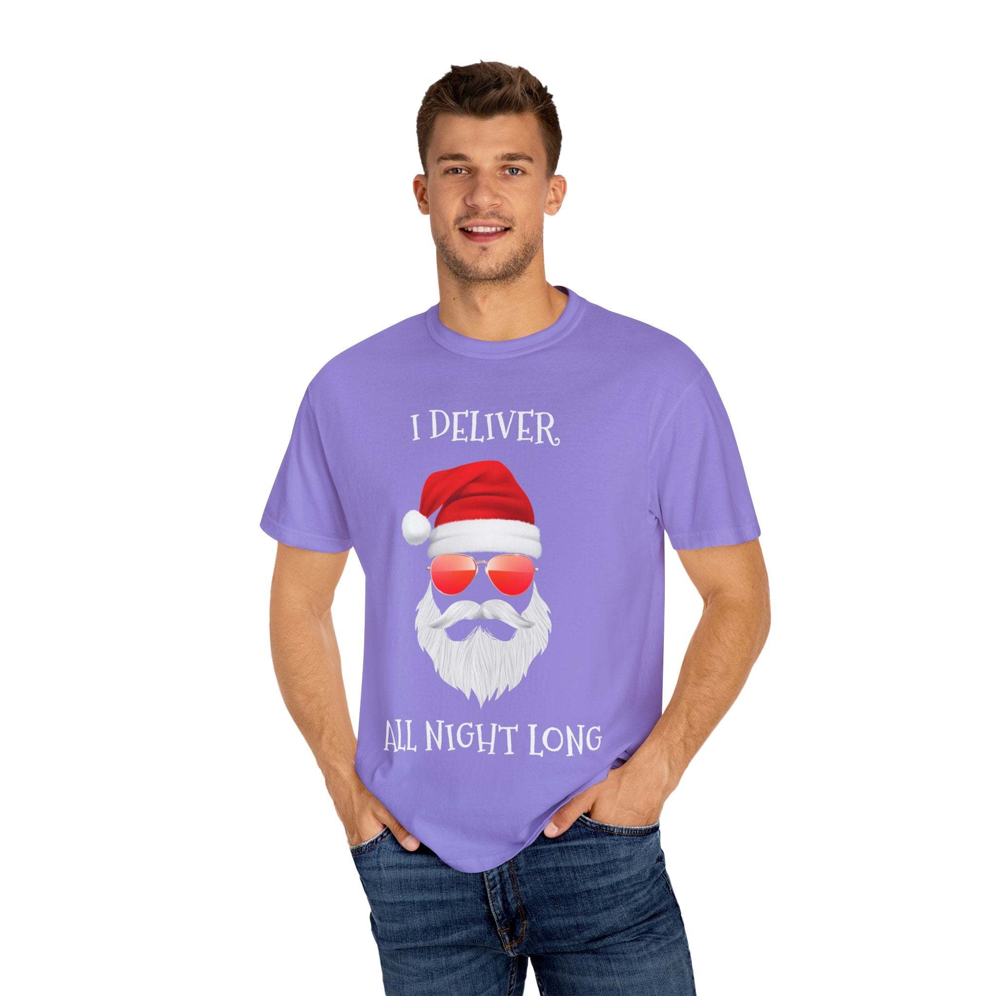 Man wearing Santa I Deliver All Night Long purple Christmas T-shirt with Santa face and sunglasses design