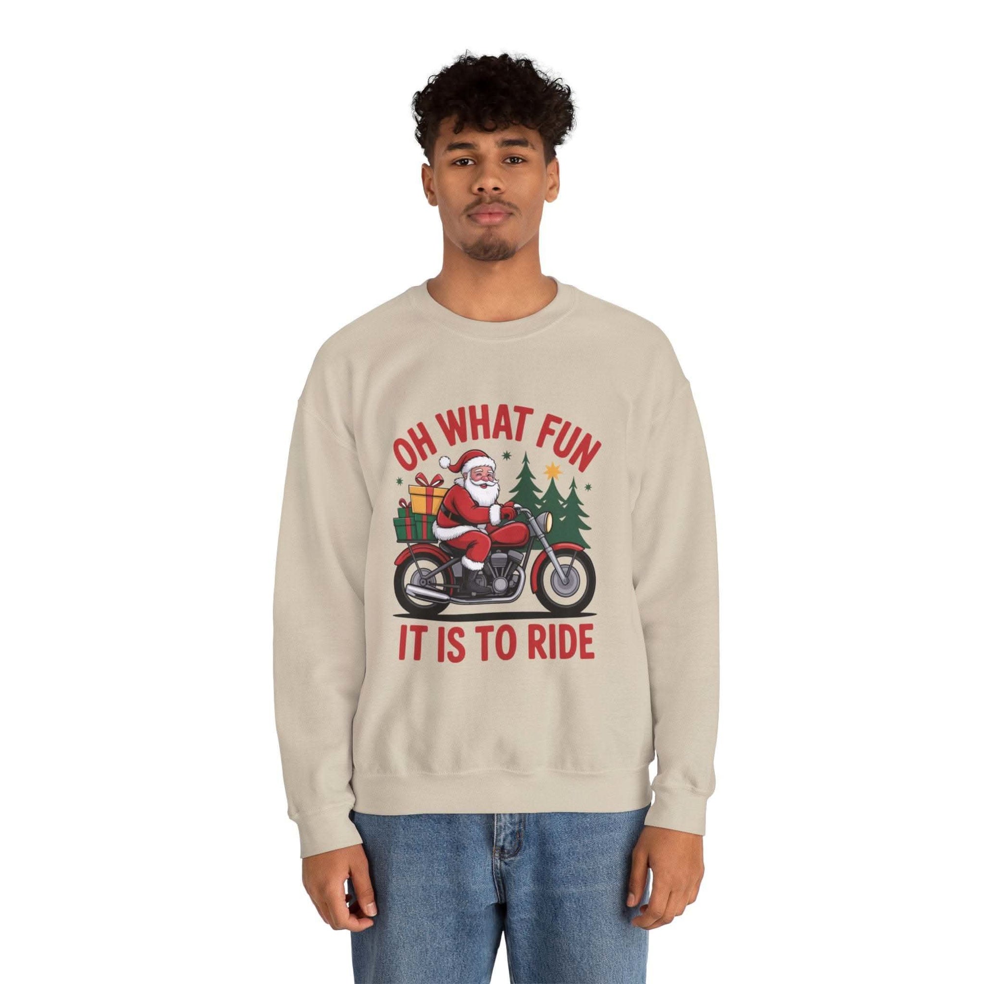 Man wearing navy Motorcycle Santa Sweatshirt with Santa on motorcycle and holiday gifts design in festive setting