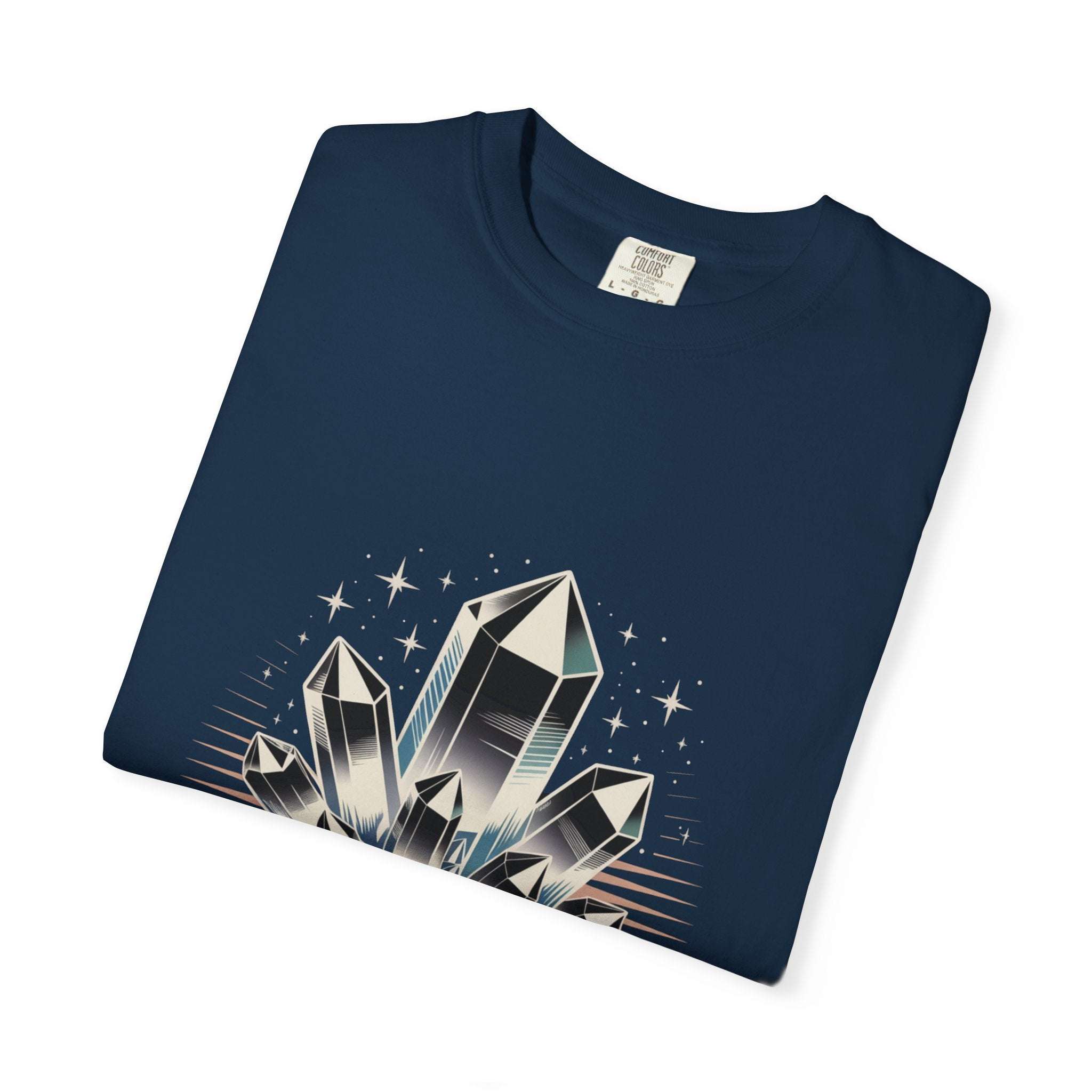 Folded navy blue t-shirt with crystal graphic on a white background