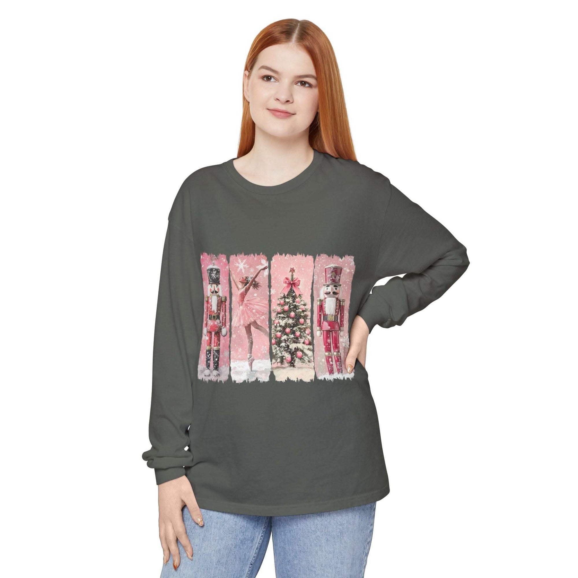 woman wearing long sleeve t-shirt with preppy pink watercolor nutcracker and Christmas tree design