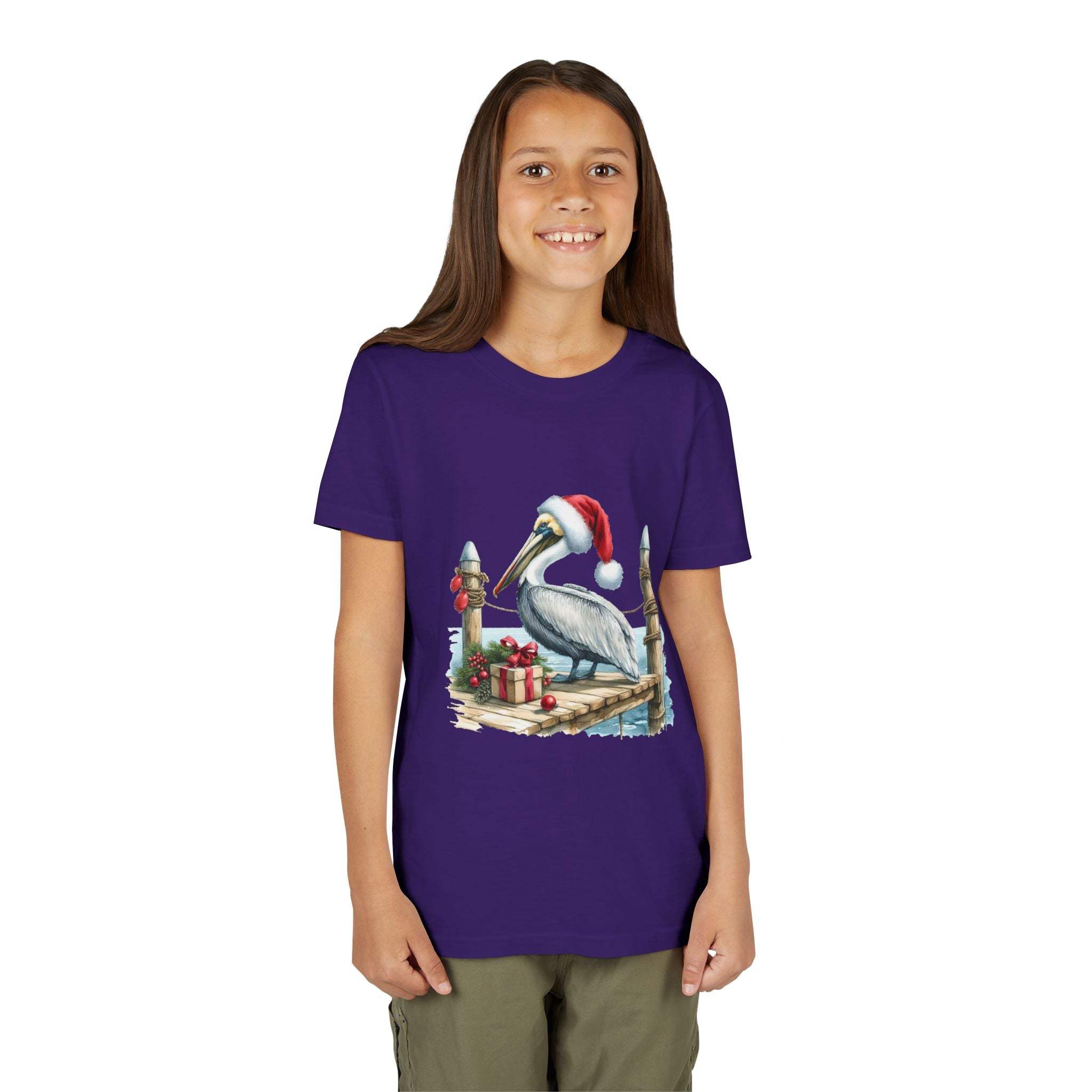 Youth wearing purple Pelican Santa Hat t-shirt with coastal holiday design