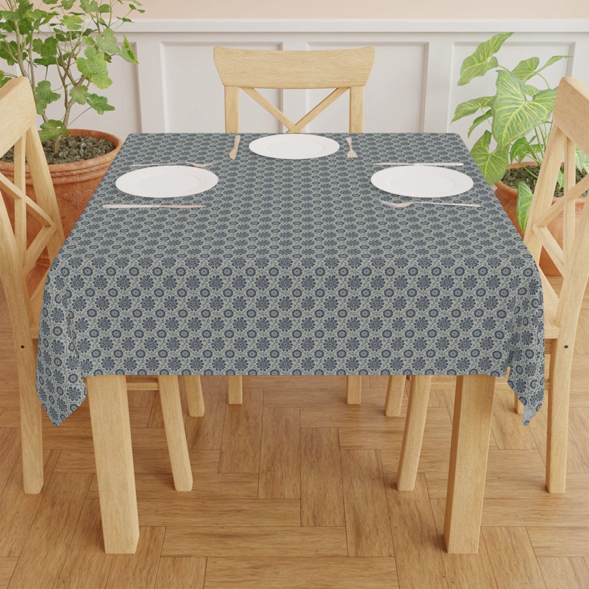 Tablecloth Indigo Floral with indigo ogee vine pattern on dining table with plates