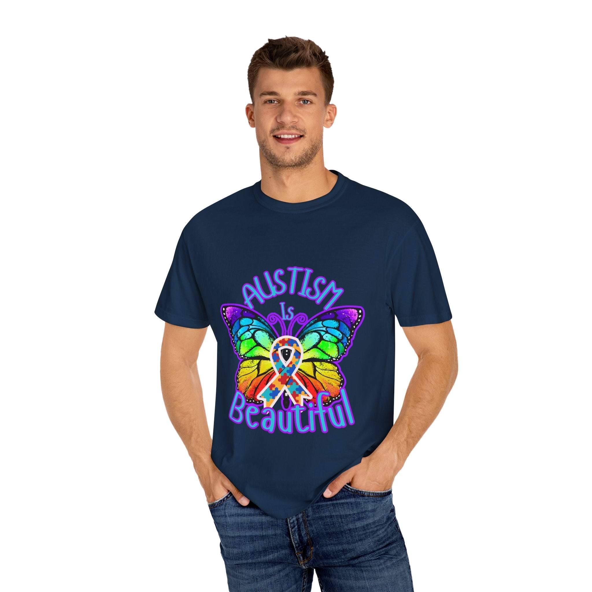 Man wearing navy Autism is Beautiful T-shirt with colorful butterfly and autism awareness ribbon design