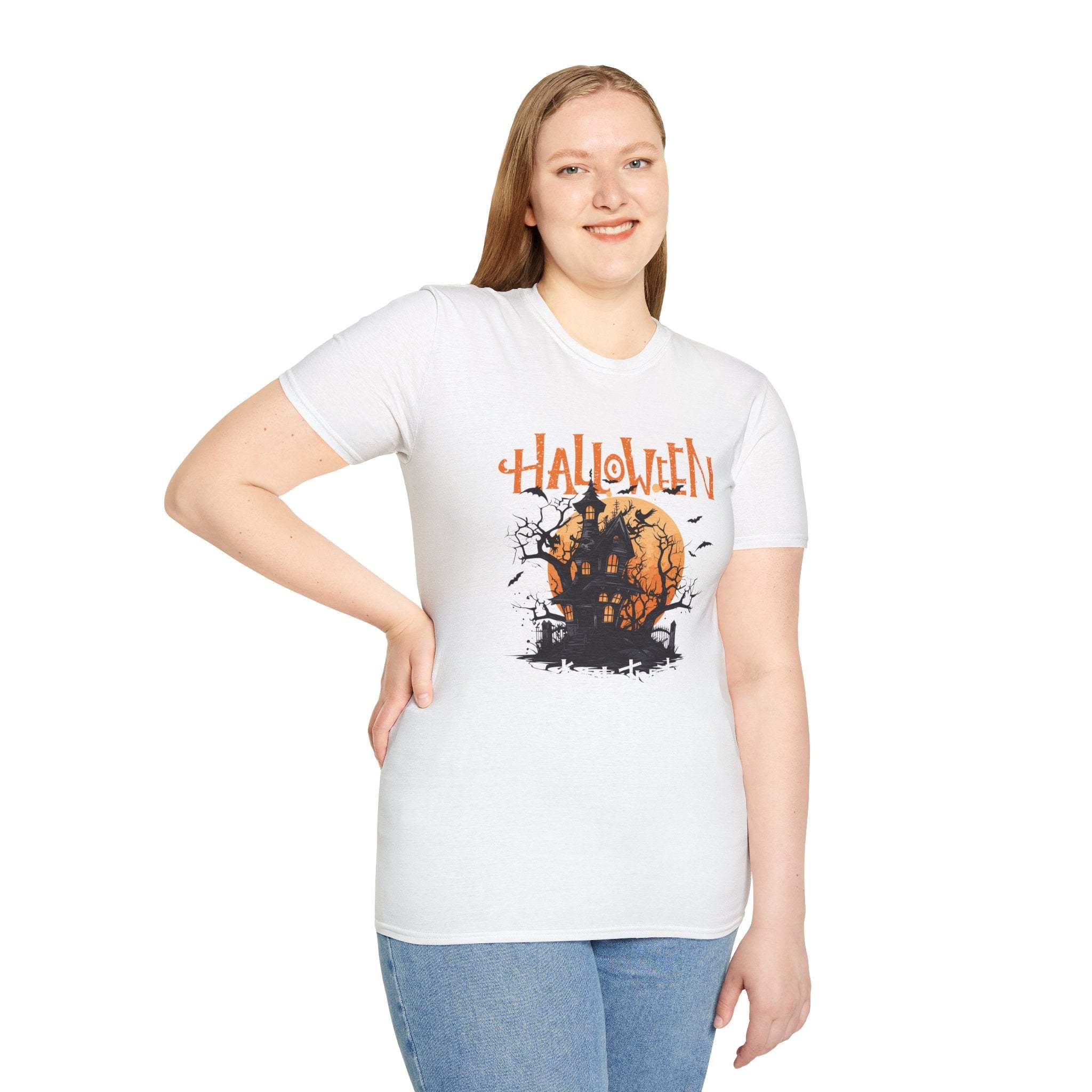 Woman wearing white Haunted House T-Shirt with Halloween haunted house graphic and orange moon design