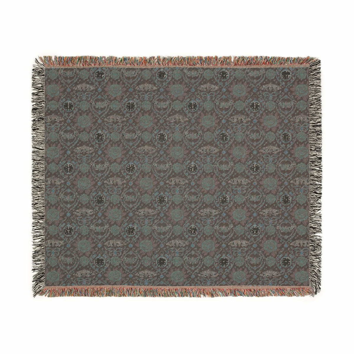 Victorian Gothmas Woven Blanket with candlelight hues and colorful fringed edges draped over dark velvet