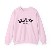 Pink sweatshirt with 'BESTIES EST. 2025' text on a white background