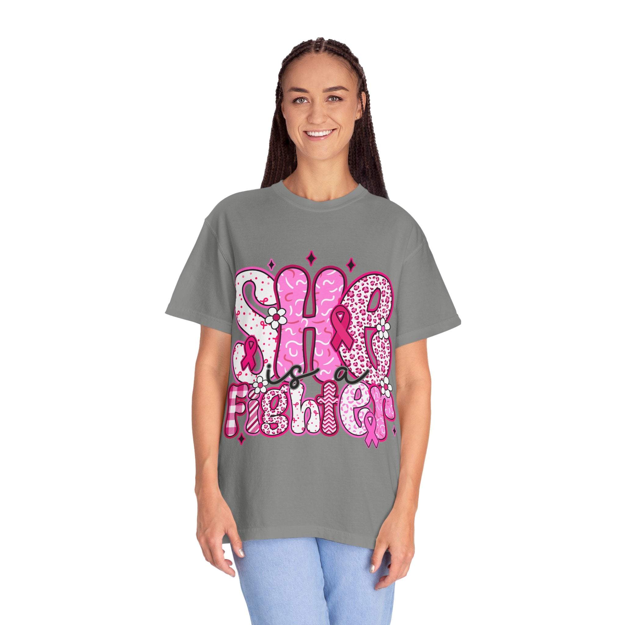 woman wearing gray fighter breast cancer t-shirt with pink lettering and design
