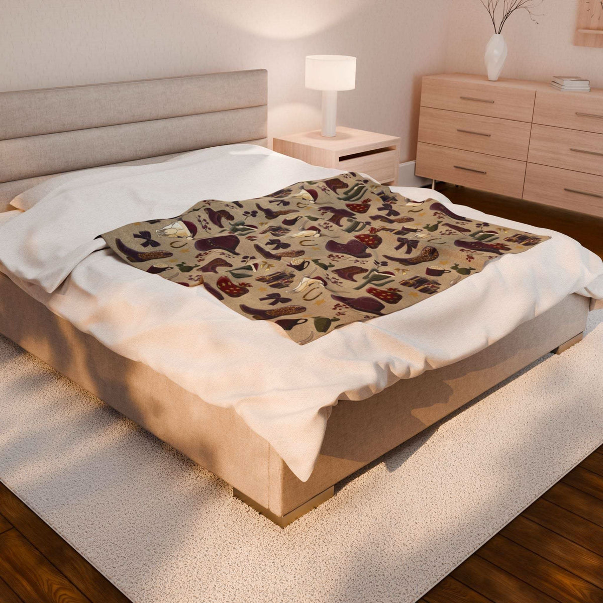 Cowboy Christmas plush blanket with festive print on bed in cozy bedroom