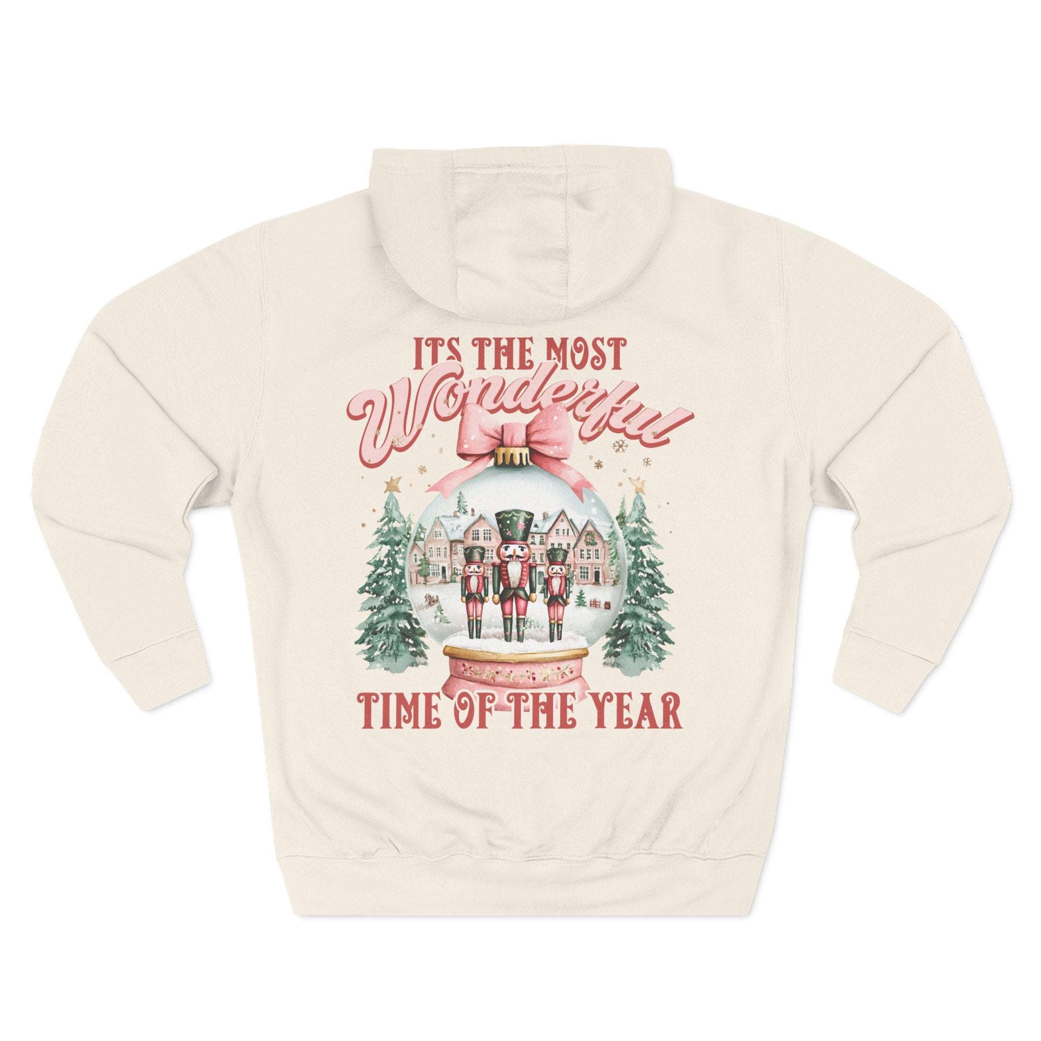Cozy white fleece hoodie with pink snow globe design and festive Nutcracker theme