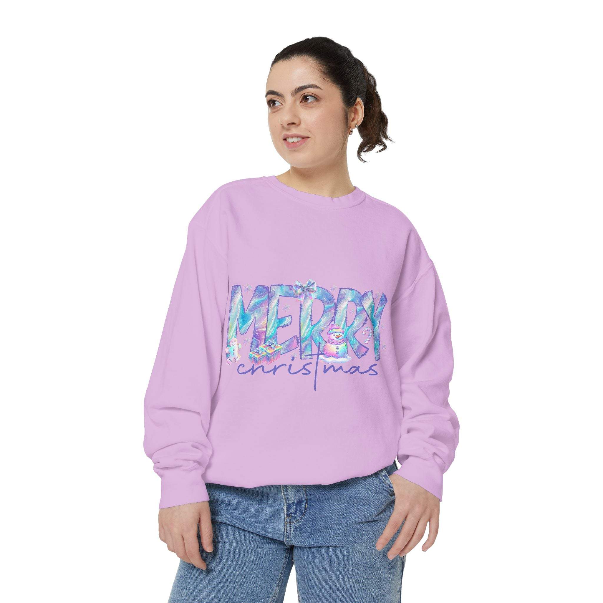 Woman wearing iridescent Merry Christmas sweatshirt in pastel purple with relaxed fit and casual jeans