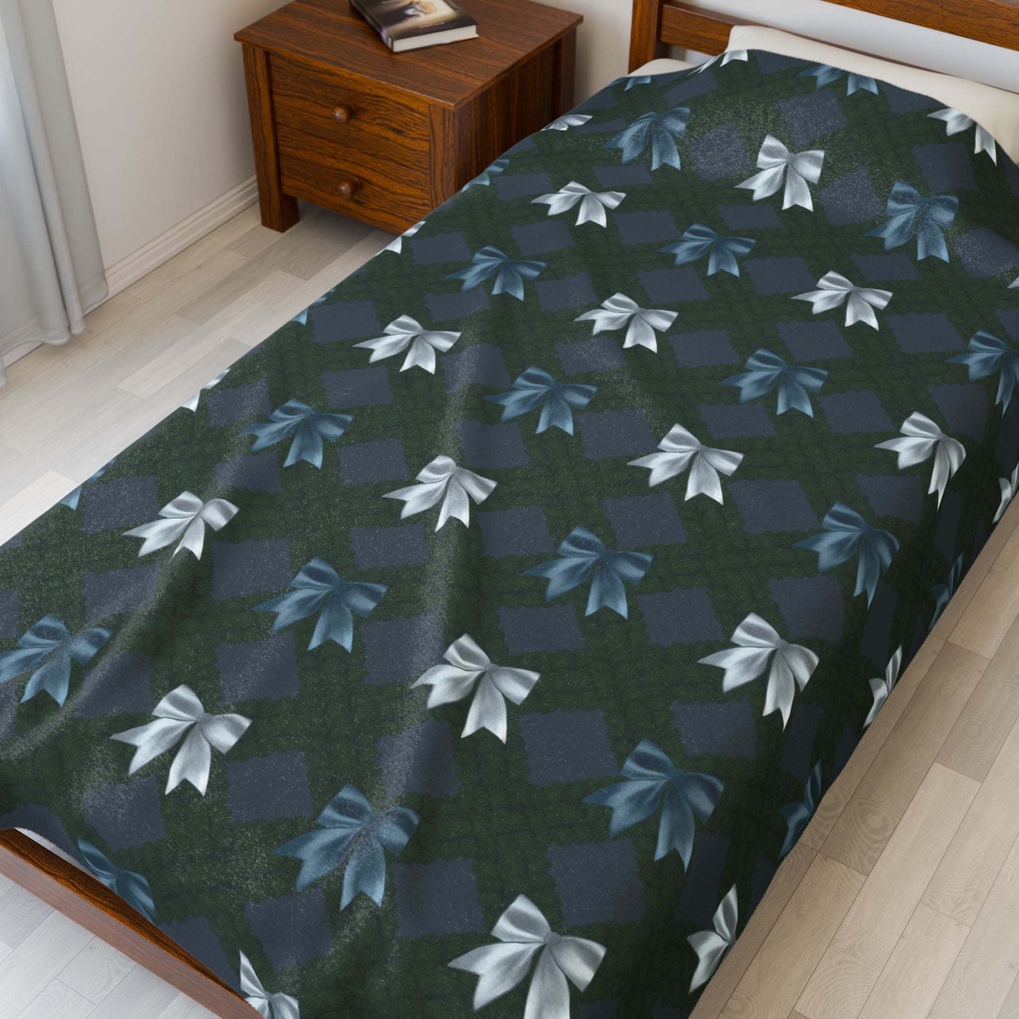 Velveteen Plush Blanket with Winter Coquette Bows design on bed in cozy bedroom