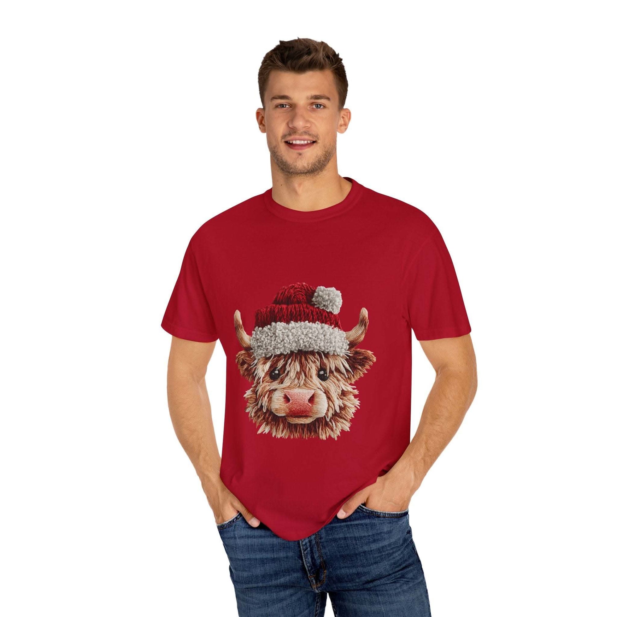 Black t-shirt featuring faux crochet yarn Highland cow Santa print by Printify, perfect for cozy Christmas wear.