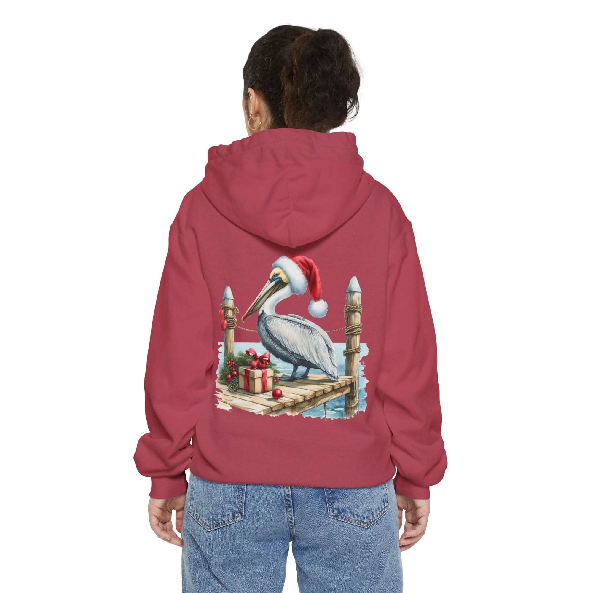 True Navy hoodie featuring a pelican in a Santa hat design by Printify