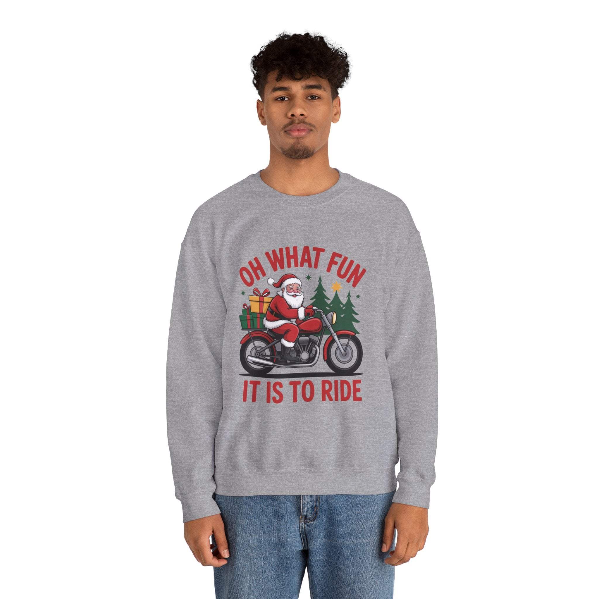 Man wearing navy Motorcycle Santa Sweatshirt with Santa on motorcycle and holiday gifts design in festive setting
