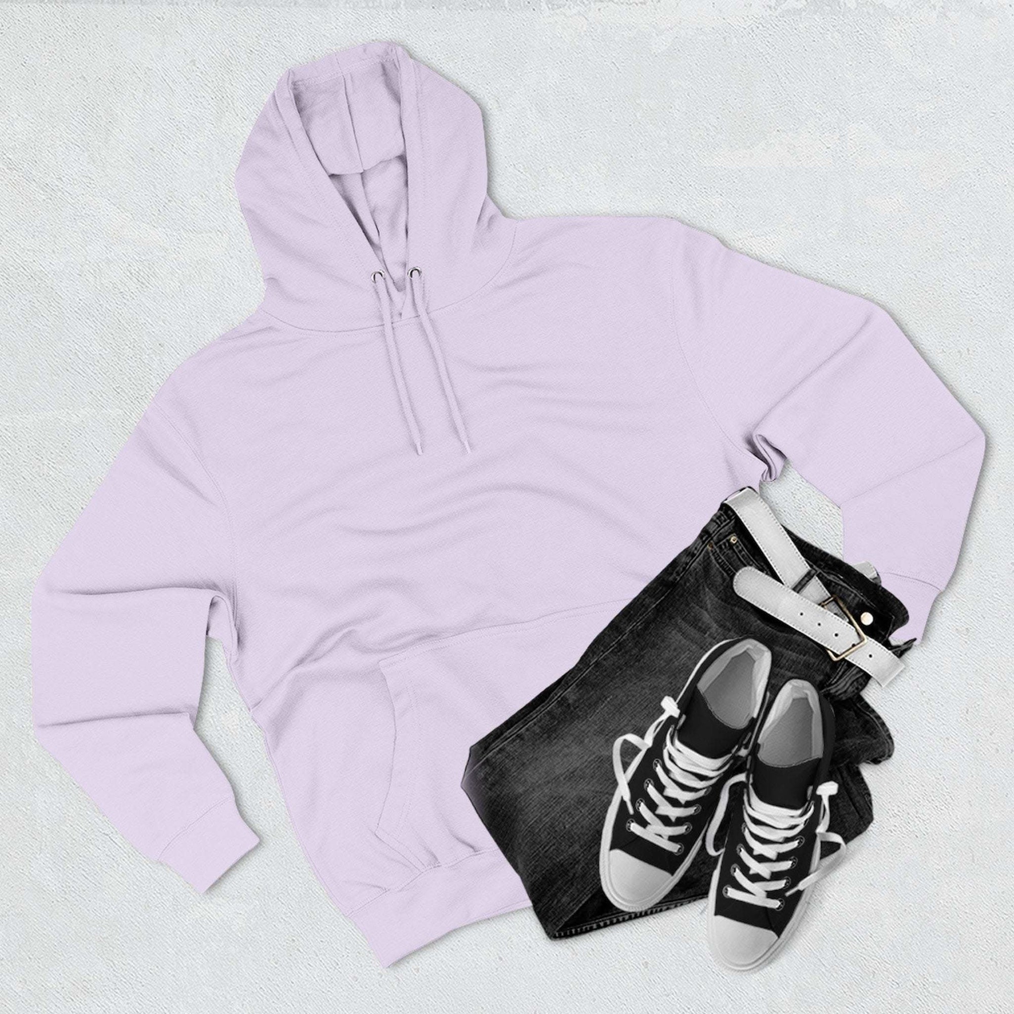 Pink fleece hoodie with adjustable hood and kangaroo pocket styled with black jeans and sneakers