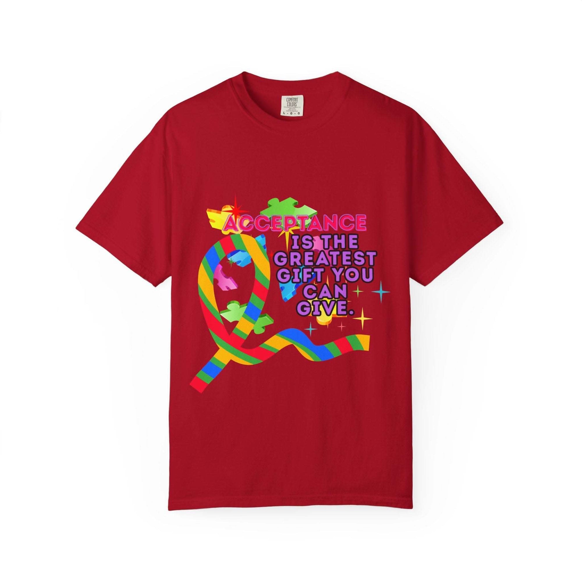 Red garment-dyed T-shirt with colorful Autism Acceptance ribbon and message promoting inclusivity and awareness