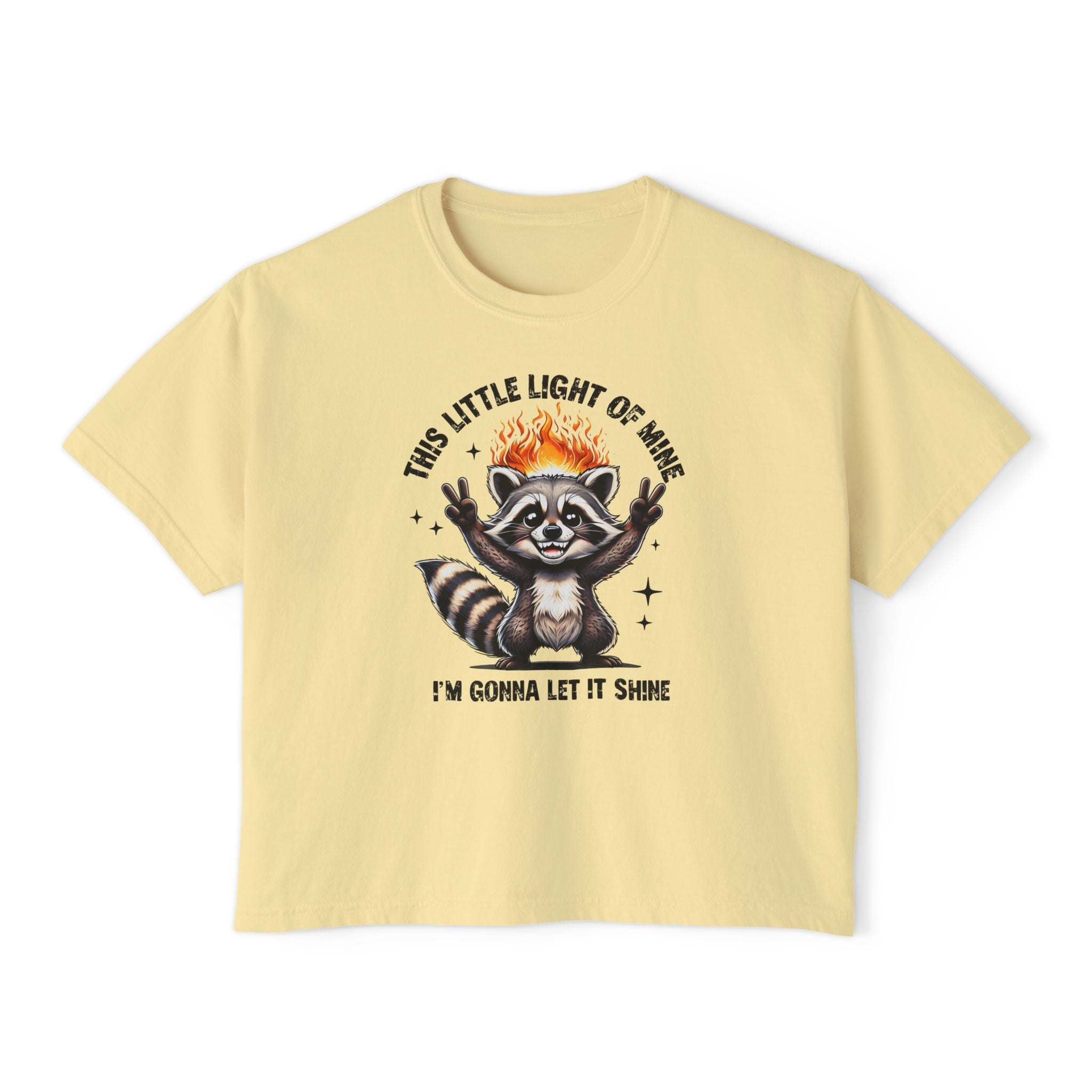 Yellow t-shirt with a raccoon graphic and text on a white background