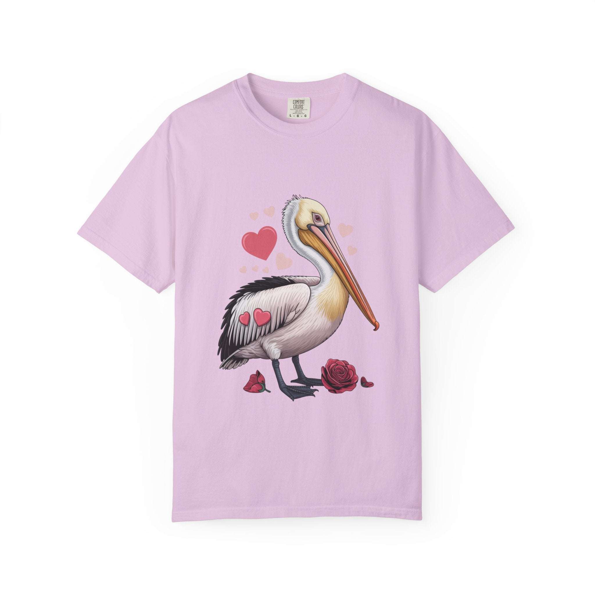Valentine Pelican Hearts T-Shirt with pelican carrying heart on sunlit shoreline in soft cotton