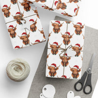 Gift wrapping papers with Santa Highland Cows Christmas design on thick white paper