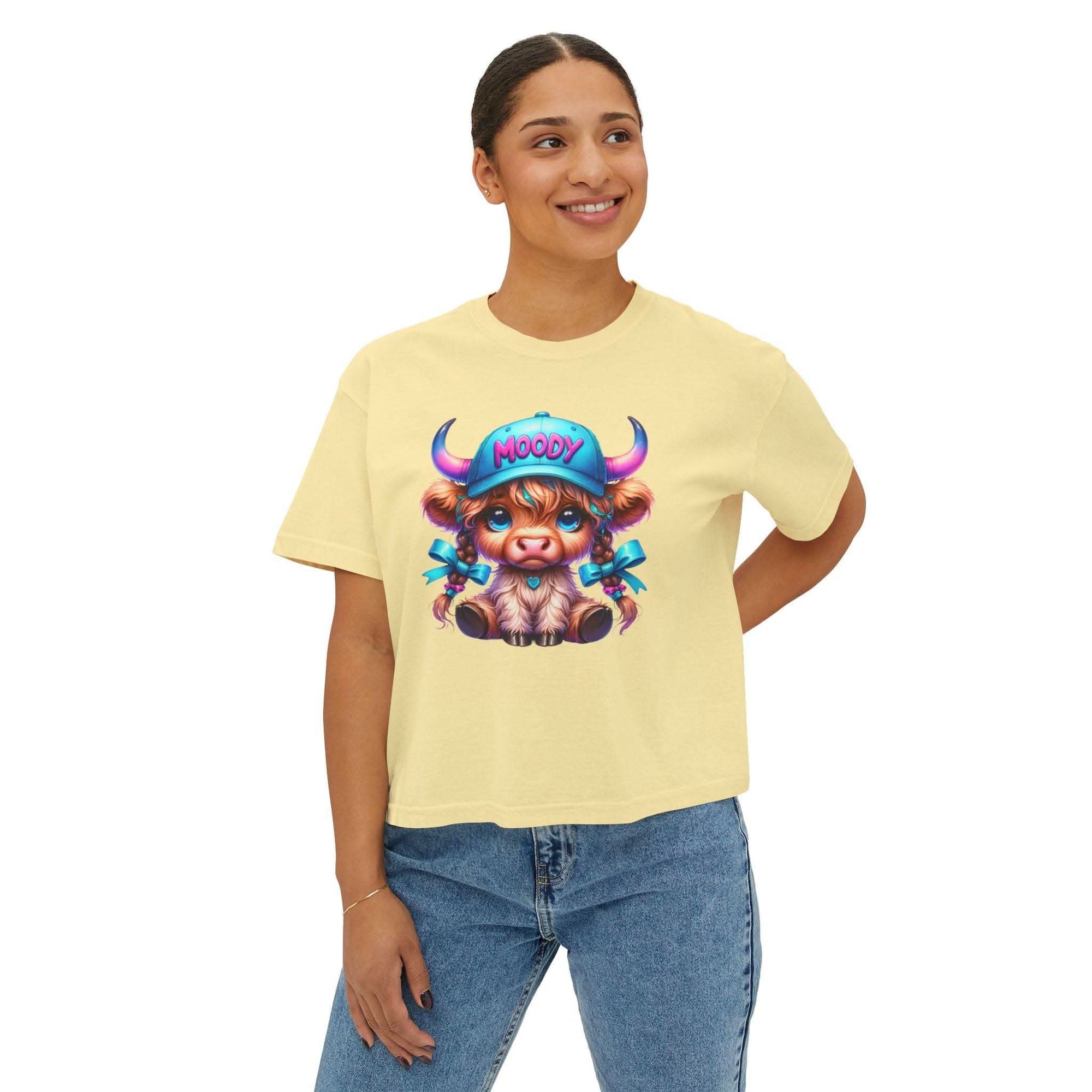 Women's boxy tee with moody Highland cow graphic in vintage pigment dye color