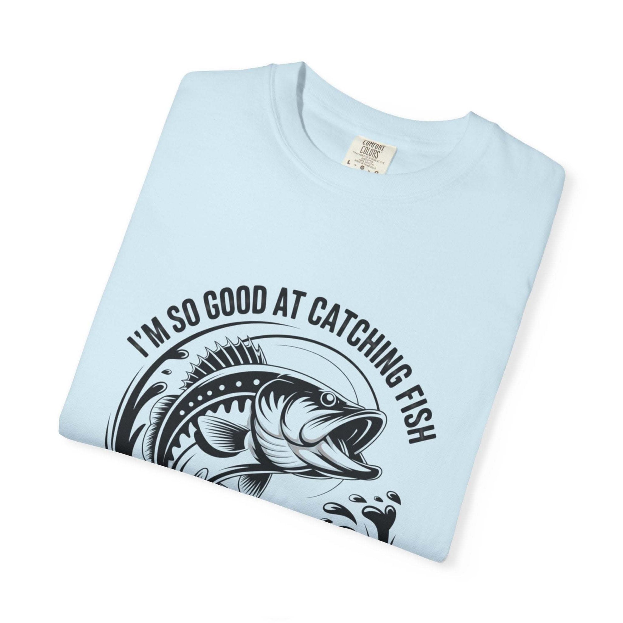 Fishing T-Shirt with humorous "So Good At Catching Fish That The Fish Tell Stories About Me" phrase on soft cotton tee