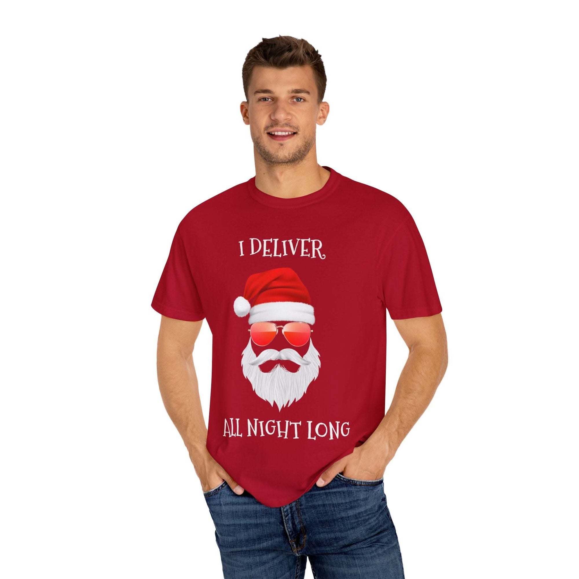 Man wearing red Santa I Deliver All Night Long Christmas T-shirt with Santa graphic and sunglasses