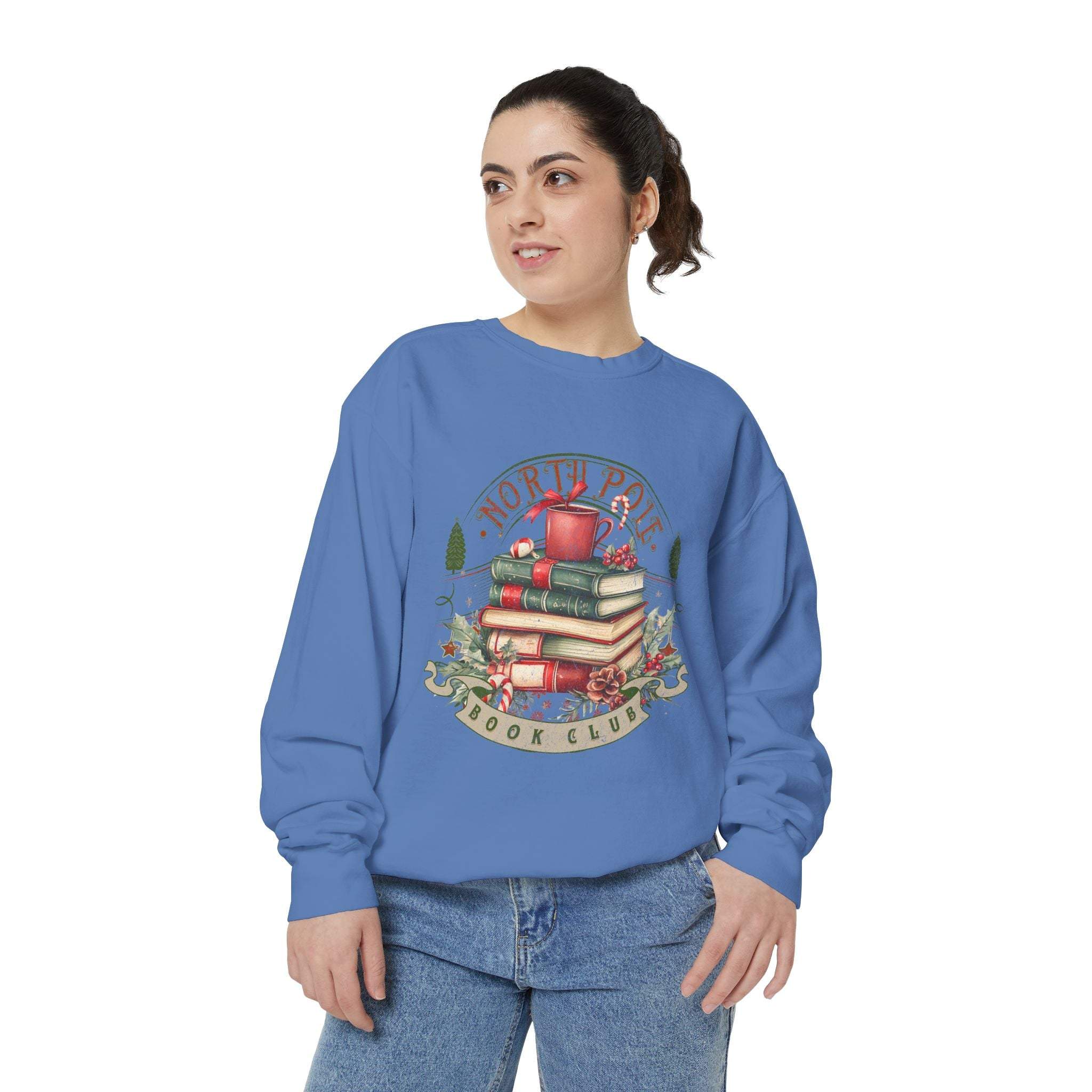 Woman wearing blue Vintage North Pole Book Club sweatshirt with festive book stack design
