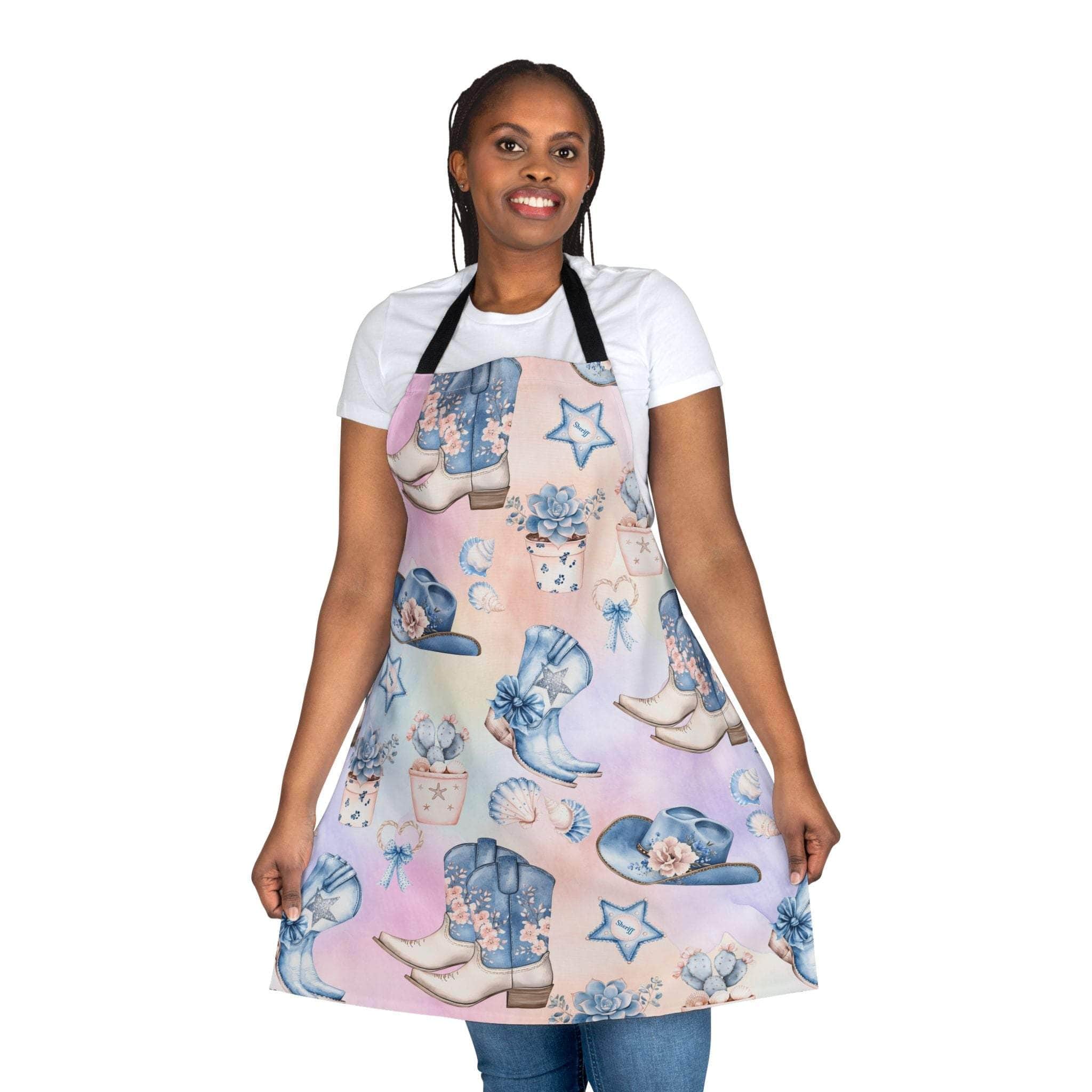Woman wearing Pastel Coastal Cowgirl apron with colorful beach-themed boots and hats design