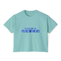 Women's boxy tee in light blue with "Blessed be the Peacemakers" printed in blue, casual and vintage style
