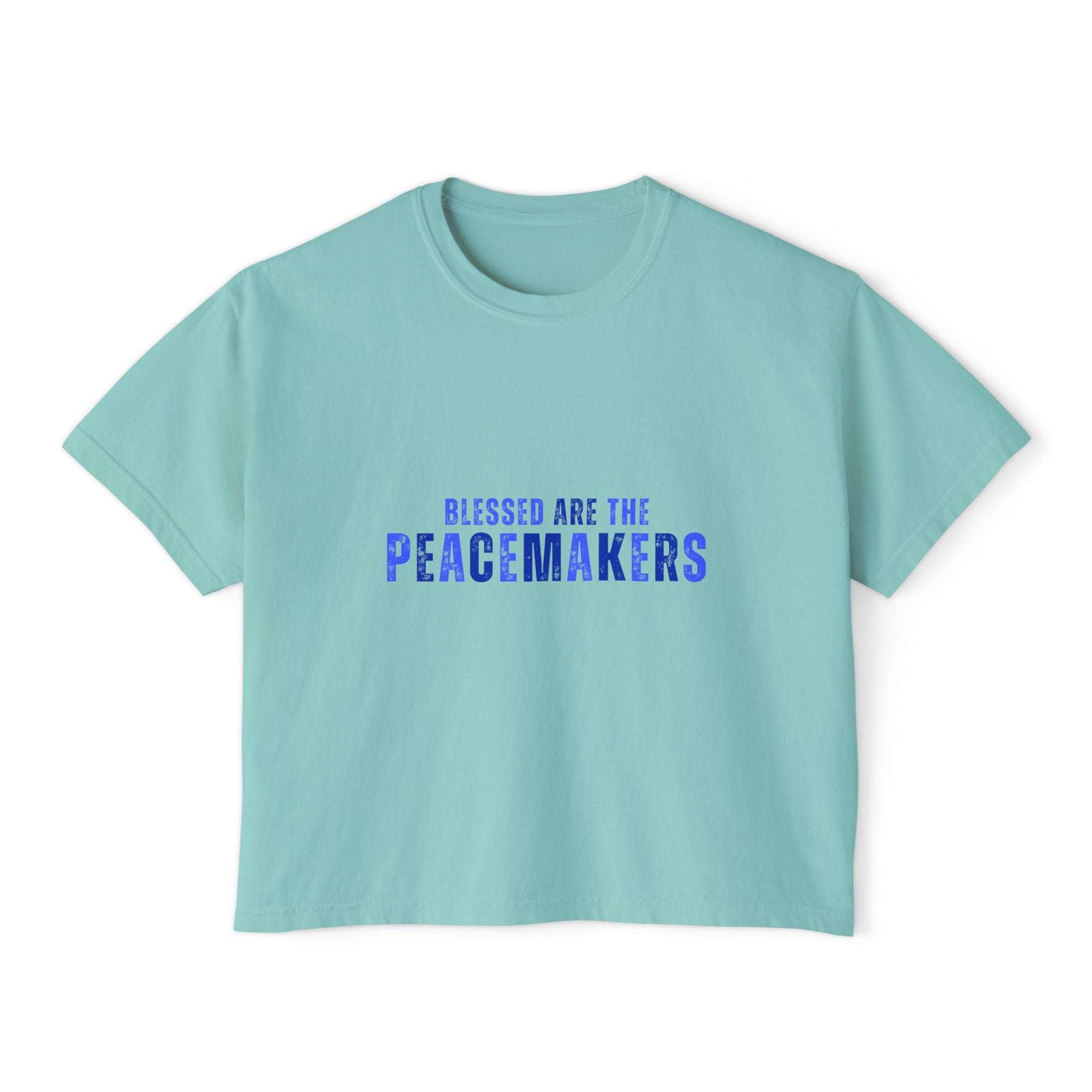 Women's boxy tee in light blue with "Blessed be the Peacemakers" printed in blue, casual and vintage style