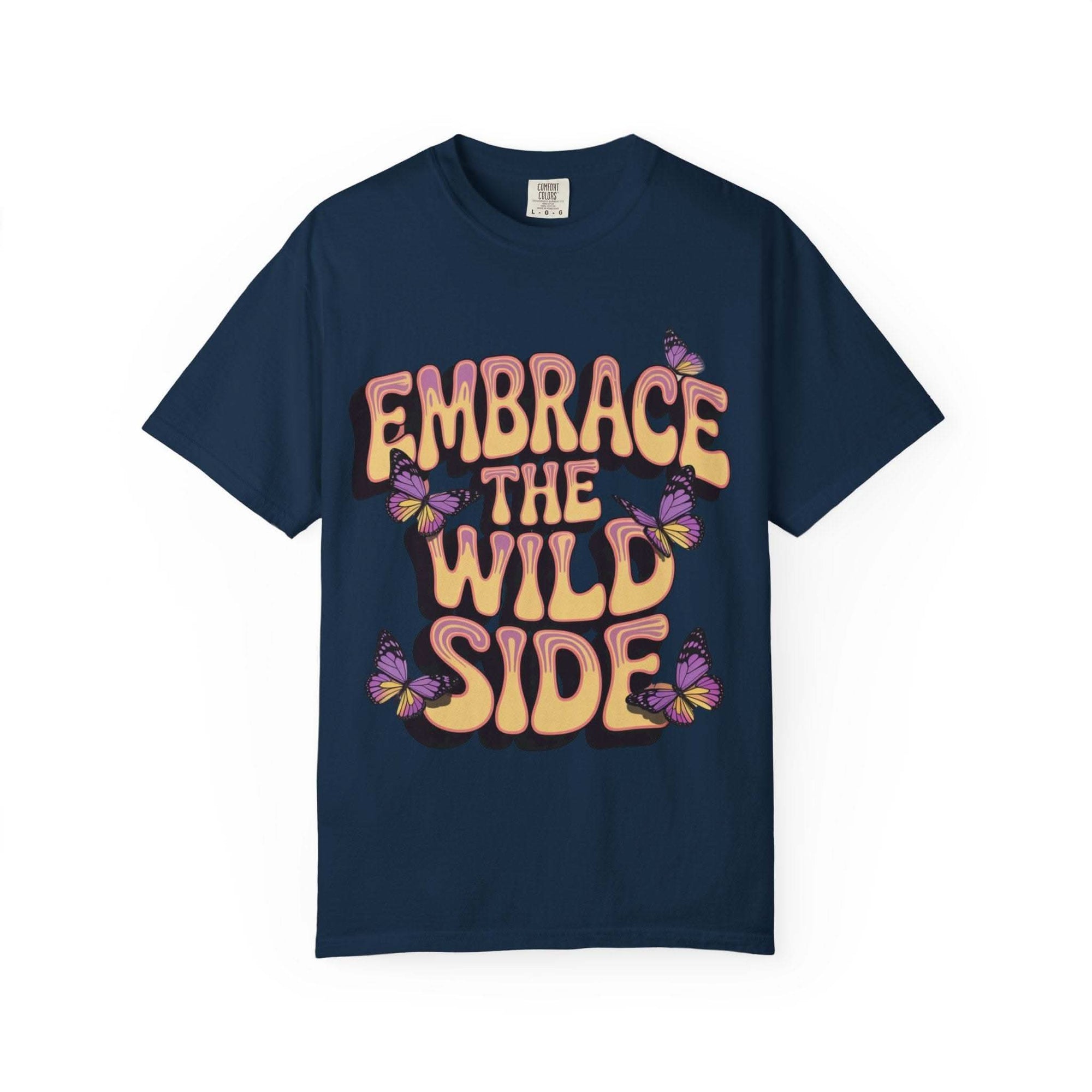 Navy garment-dyed T-shirt with "Embrace the Wild Side" text and butterfly design, unisex casual wear.