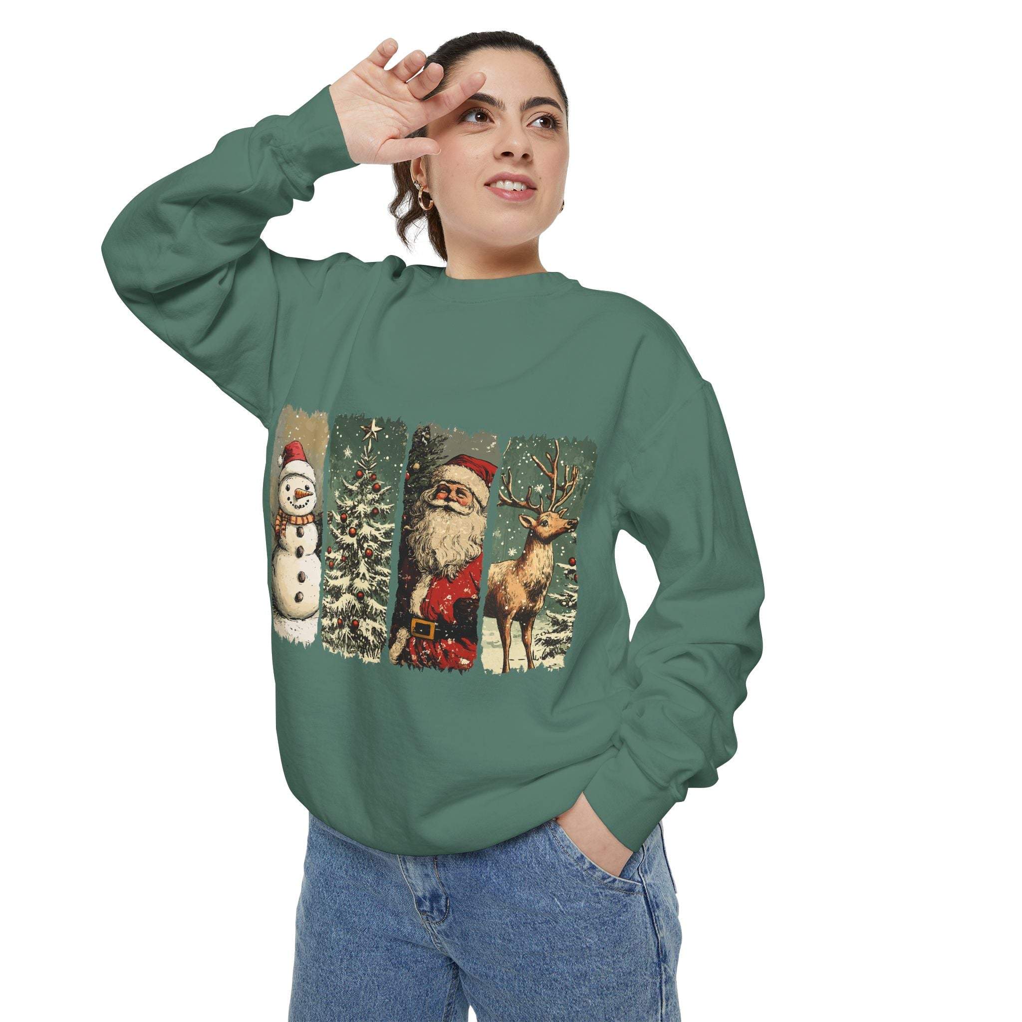 Vintage Christmas sweatshirt with watercolor snowman, Santa, tree, and reindeer design on green fabric
