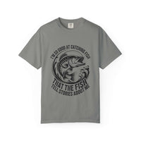 Fishing T-shirt with humorous "So Good At Catching Fish That The Fish Tell Stories About Me" text, soft cotton tee for anglers