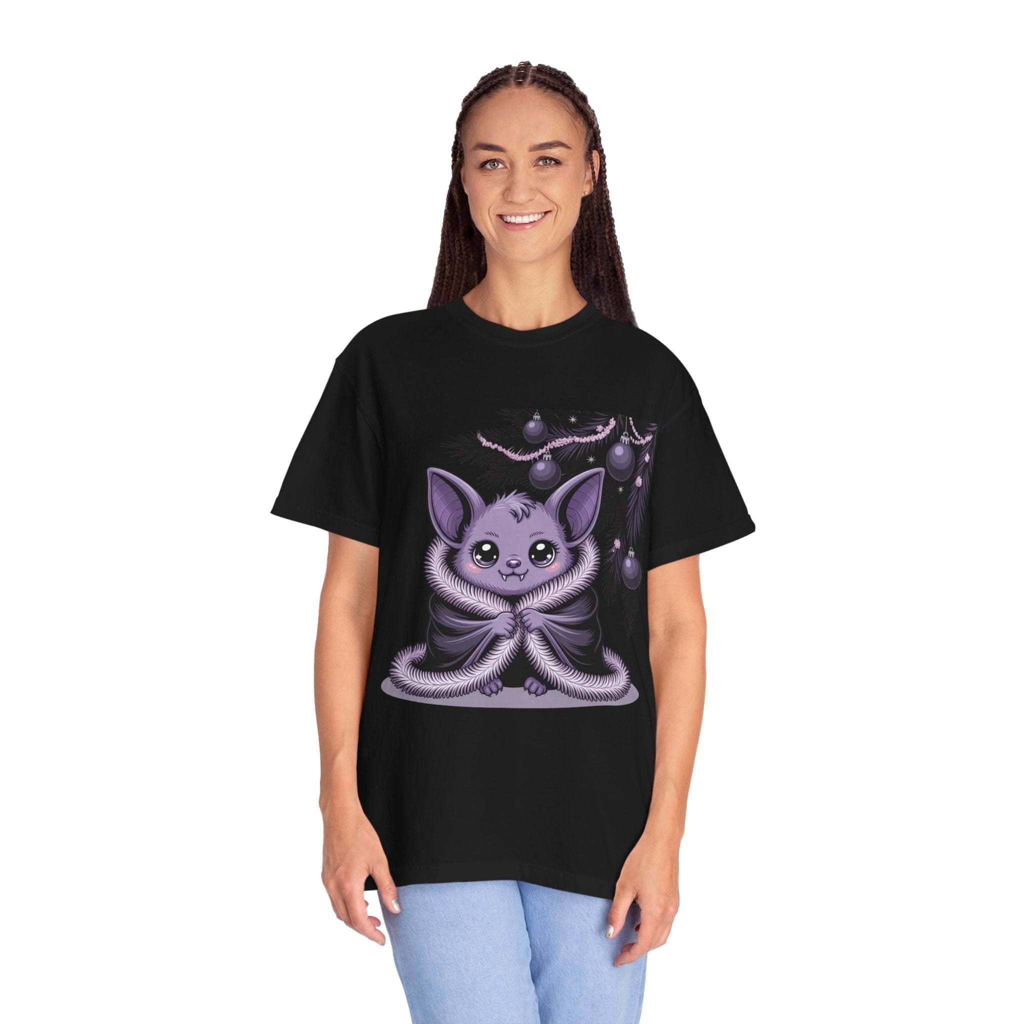 Person wearing a black t-shirt with a cute creature design on a white background