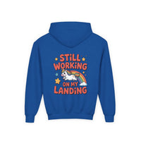 Kids unicorn rainbow design hoodie with playful unicorn and rainbow graphic on white fabric