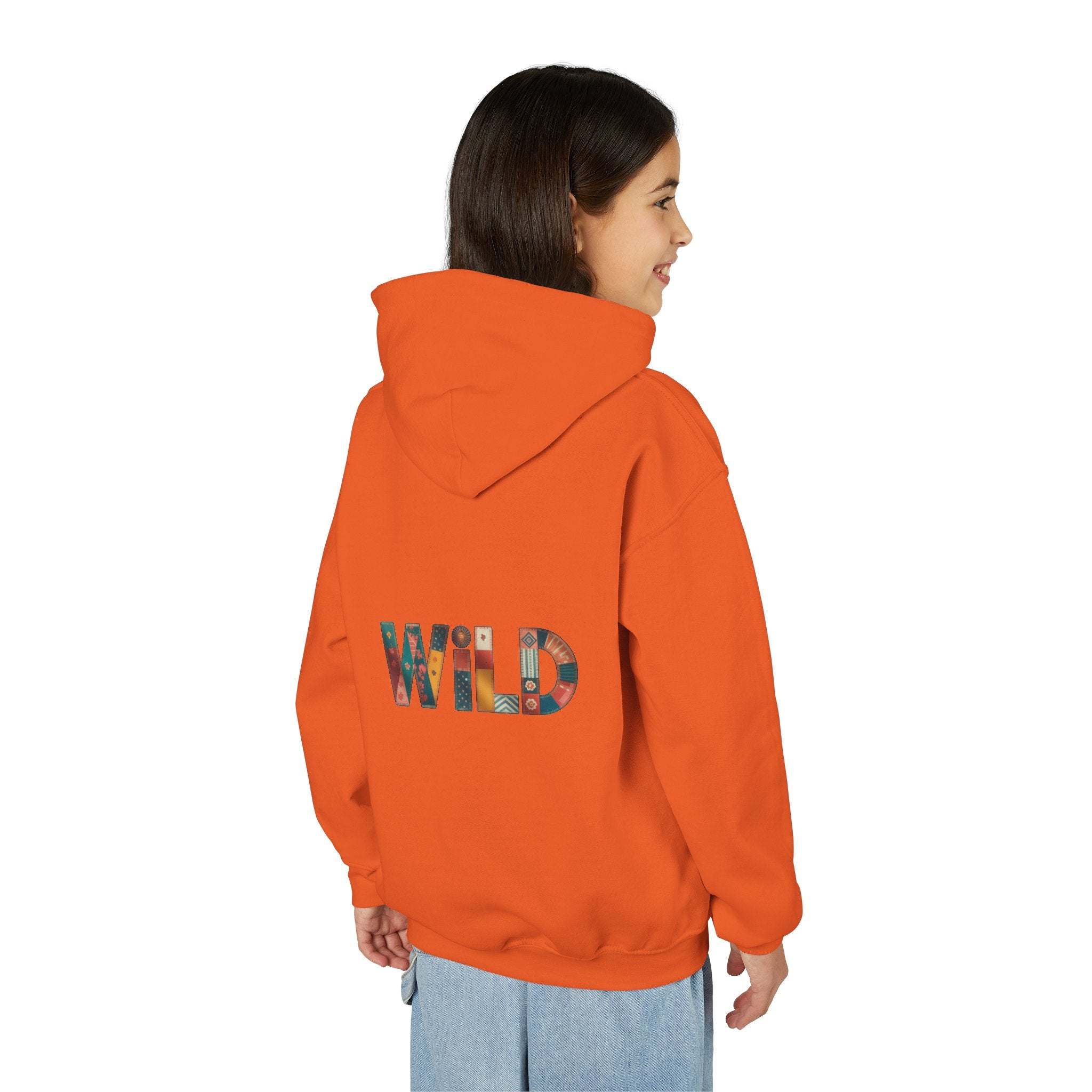 Child wearing orange Patchwork Wild Word Hoodie with colorful WILD text on back and kangaroo pocket