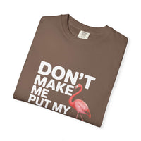 Dont Make Me Put My Foot Down flamingo graphic on vintage pink T-shirt with bold white text
