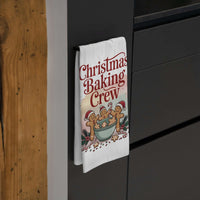 White cotton tea towel with 'Christmas Baking Crew' design, ideal for festive kitchen decor.