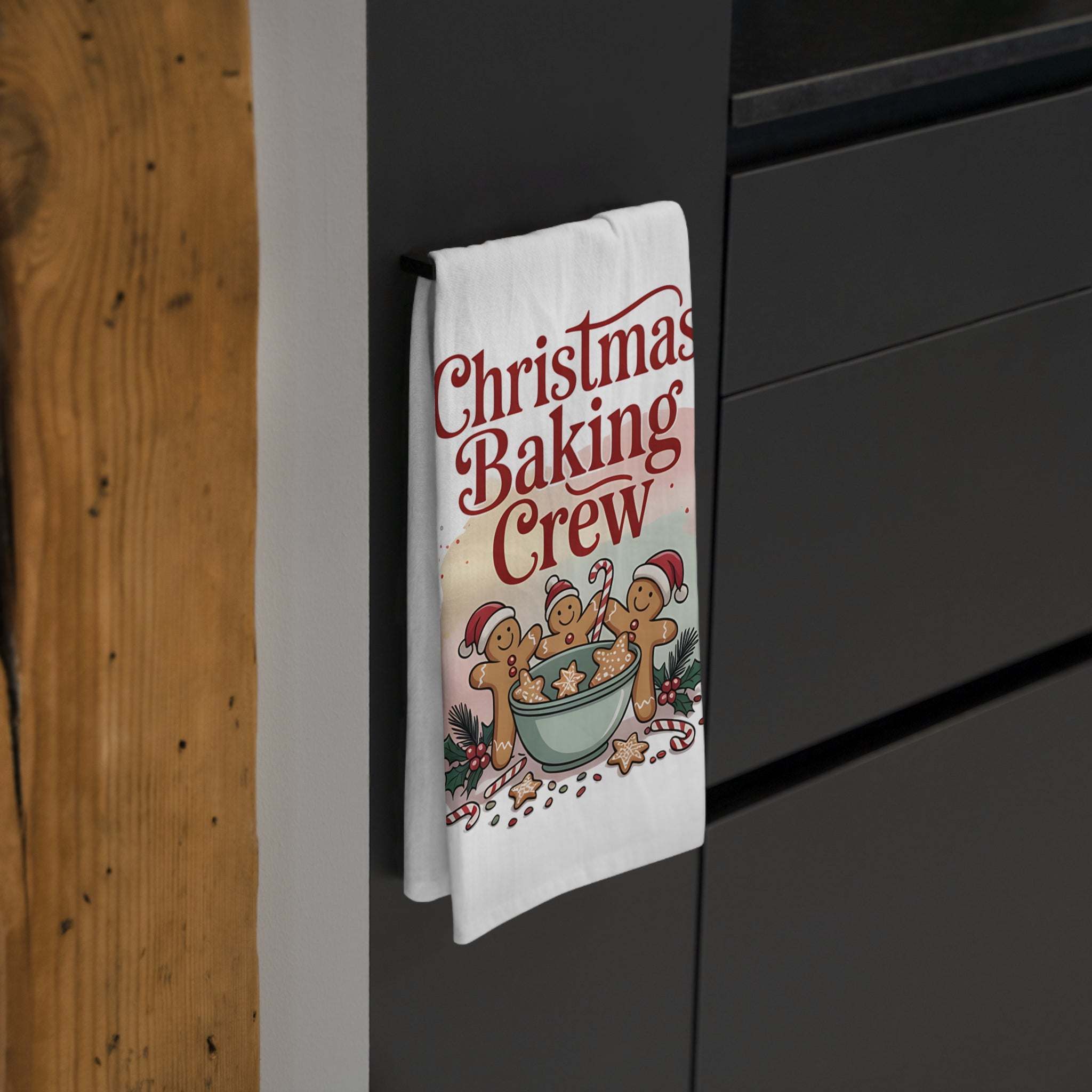 White cotton tea towel with 'Christmas Baking Crew' design, ideal for festive kitchen decor.