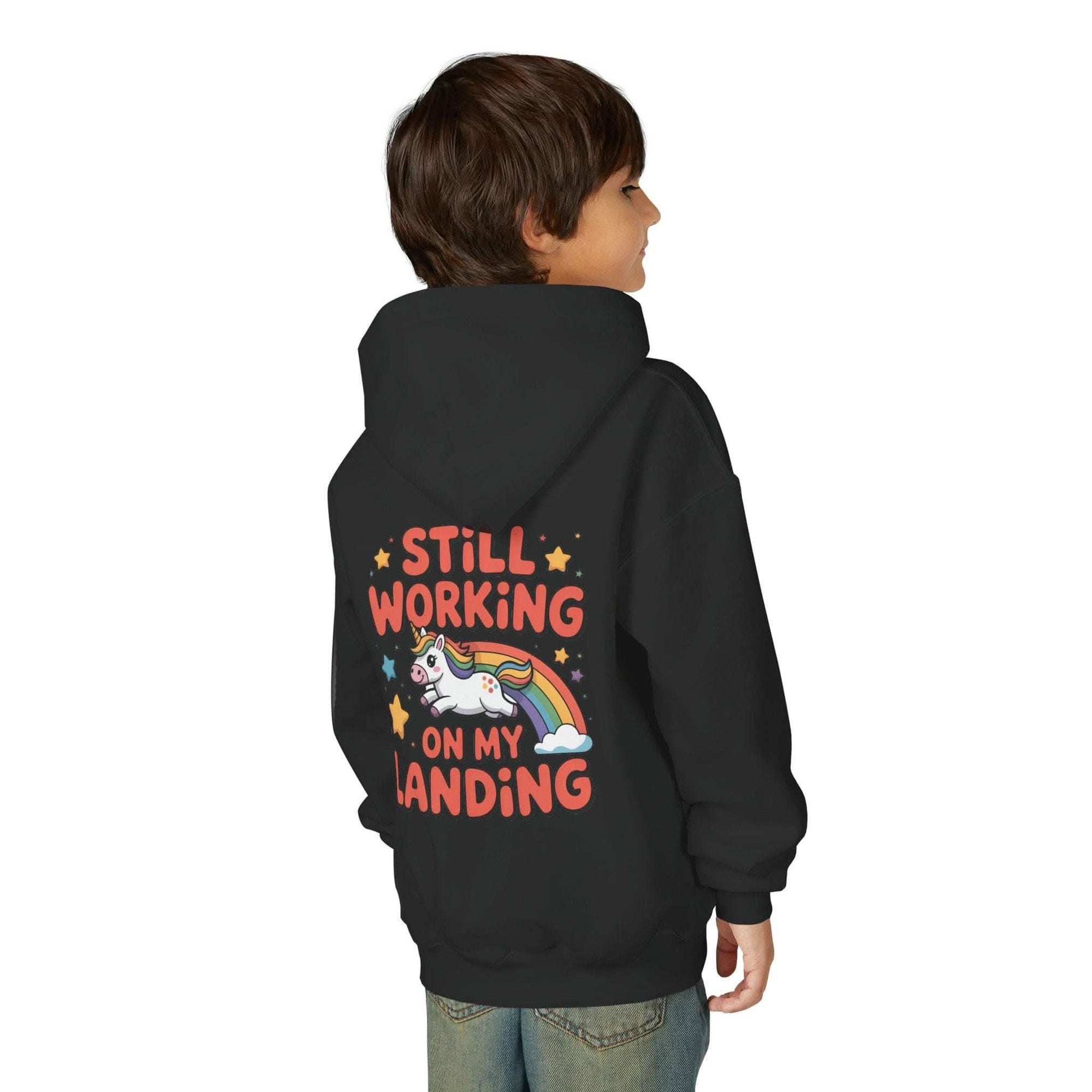 Kids hoodie with colorful unicorn rainbow design and playful "Still Working On My Landing" text