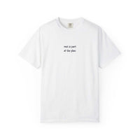 White t-shirt with text 'rest is part of the plan' on a white background